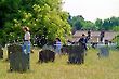 Mother and Kids in a Churchyard, England