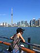 Tourist Girl and Toronto CN Tower in Background.