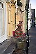 Wood Doll at shop entrance, Woodbridge, Suffolk, England